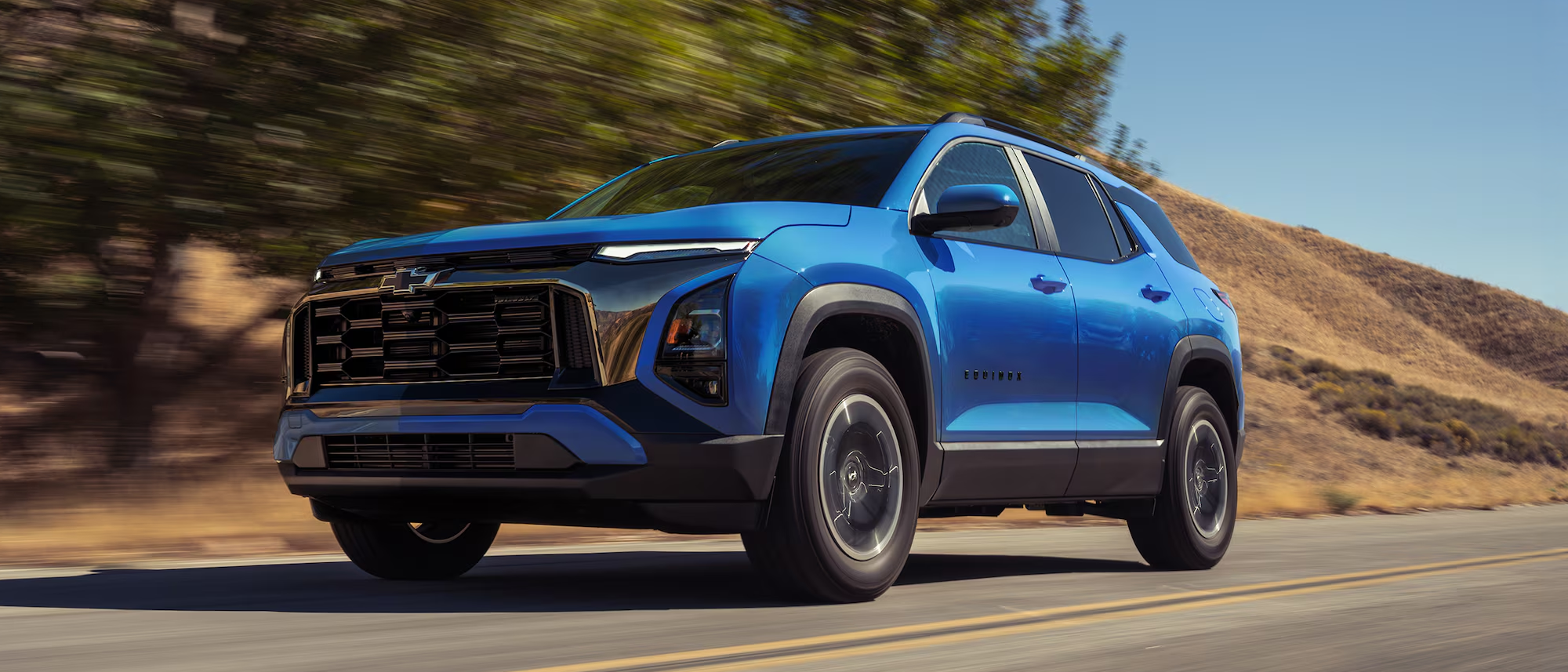 Reef Blue Metallic 2027 Chevrolet Equinox driving on road